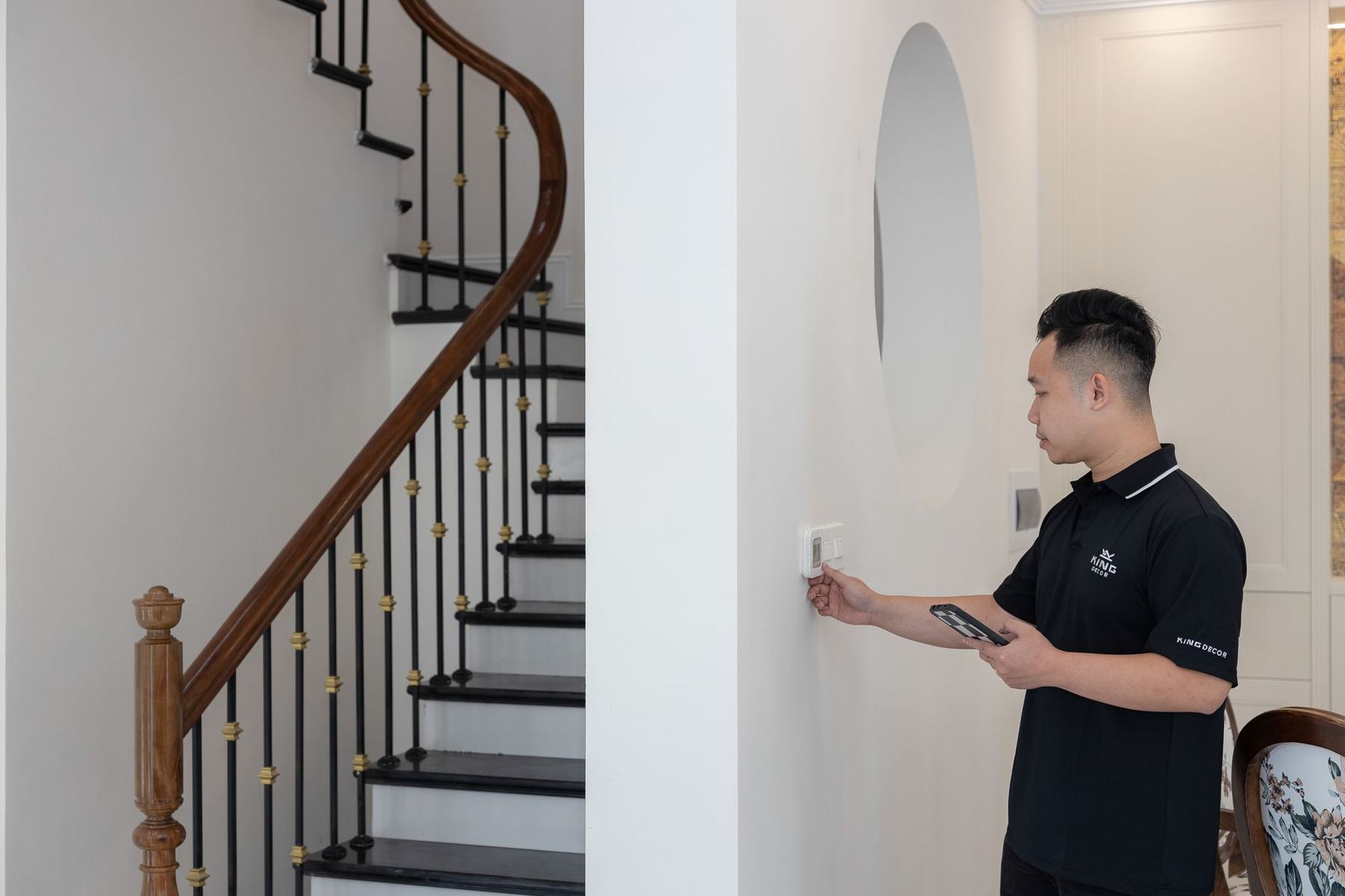 Installer configuring a discreet home control panel