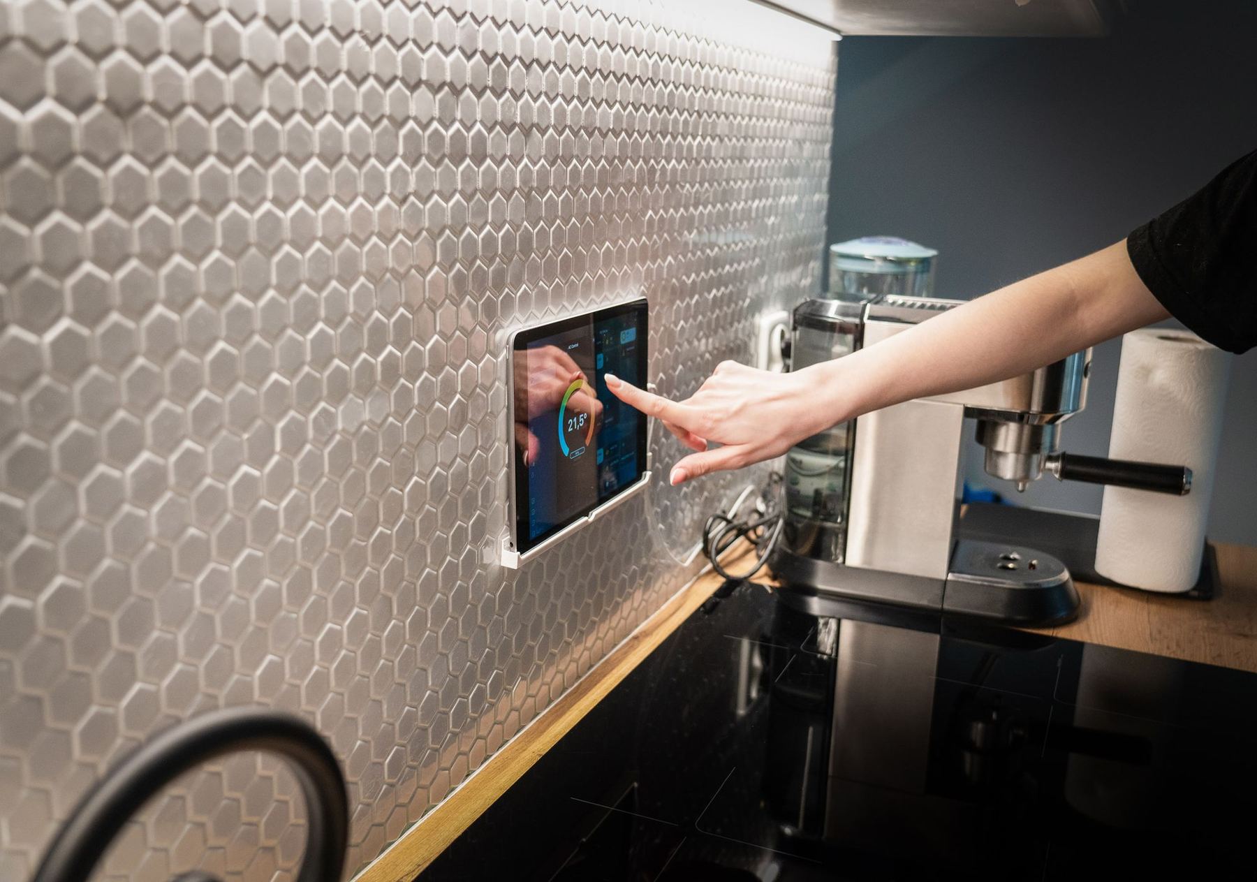 Refined smart-home control detail in a modern kitchen